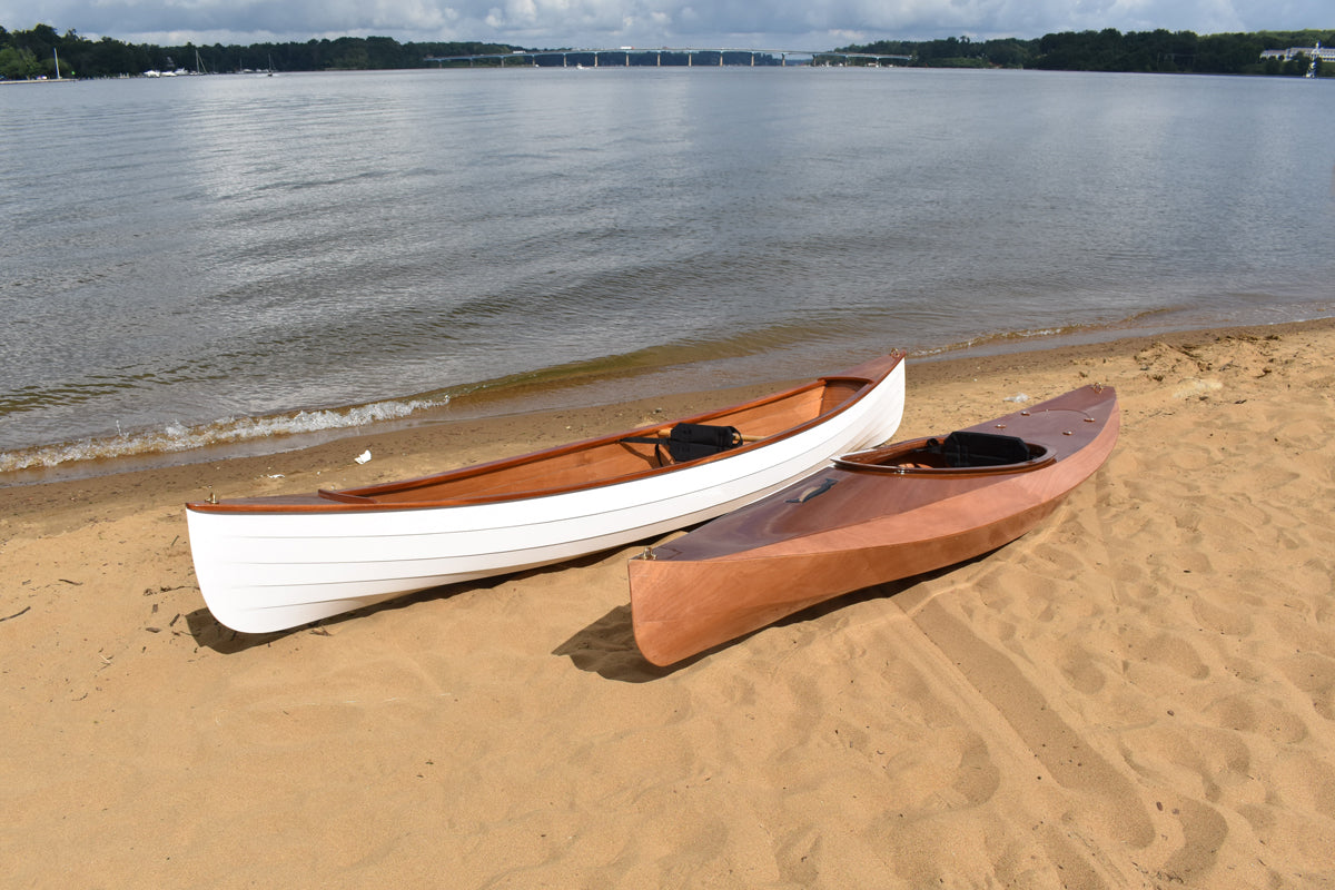A Sassafras 12 canoe and Wood Duck 10 kayak on the beach at Jonas Green Park on the Severn River. Built by Matt S.