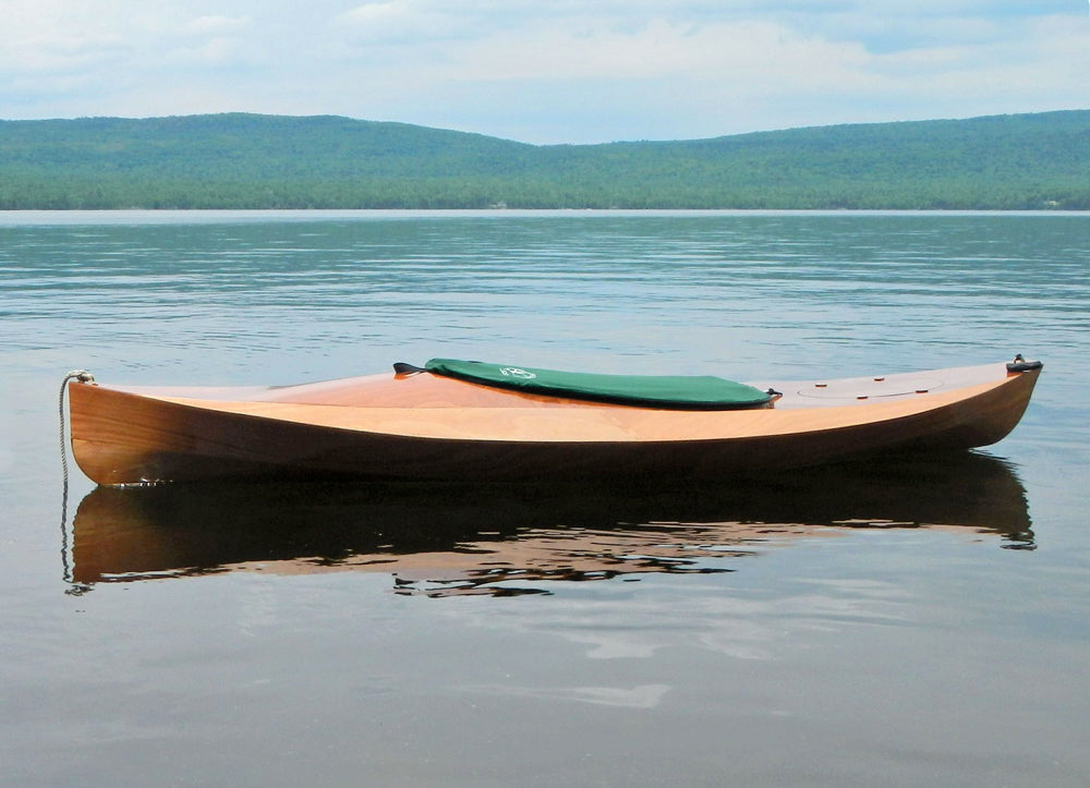 A Wood Duck 10 kayak floating on Mooselookmeguntic Lake, from builder David C.