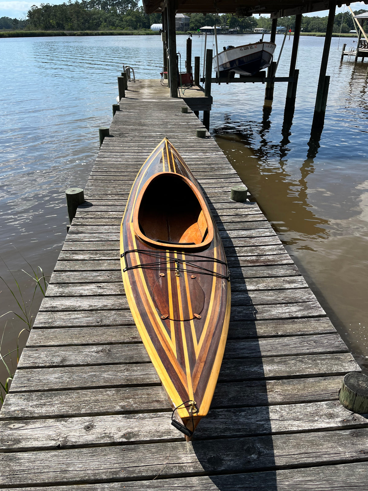 A Wood Duck 12 Hybrid kayak on the dock after the first voyage. Built by Charles P.