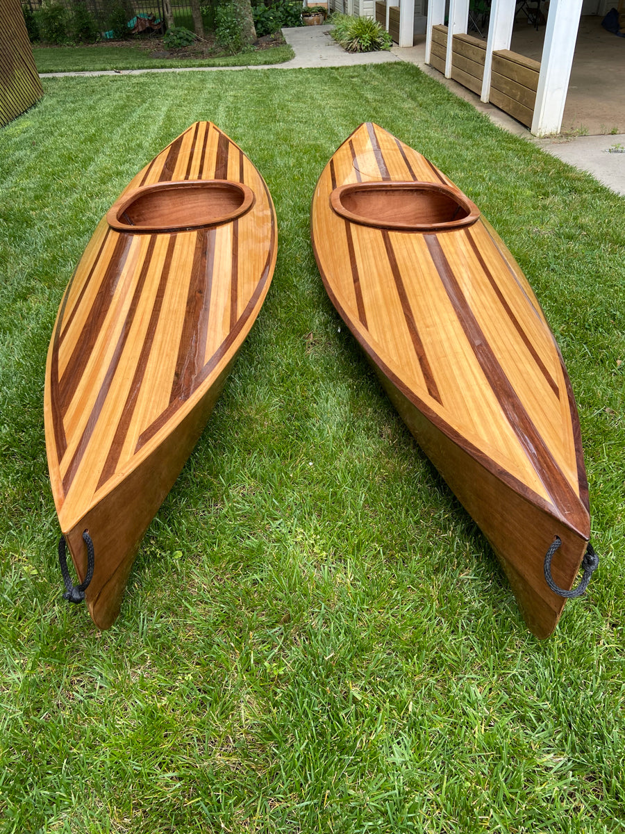 A pair of Wood Duck 12 Hybrid kayaks with walnut and cypress decks built by Dave W.