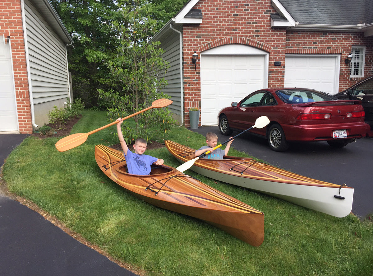 Kids testing the fit of a pair of Wood Duck 12 Hybrid kayaks built by Pat B.