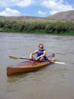 A man paddling a Wood Duck 14 kayak built by Hal J. Thumbnail