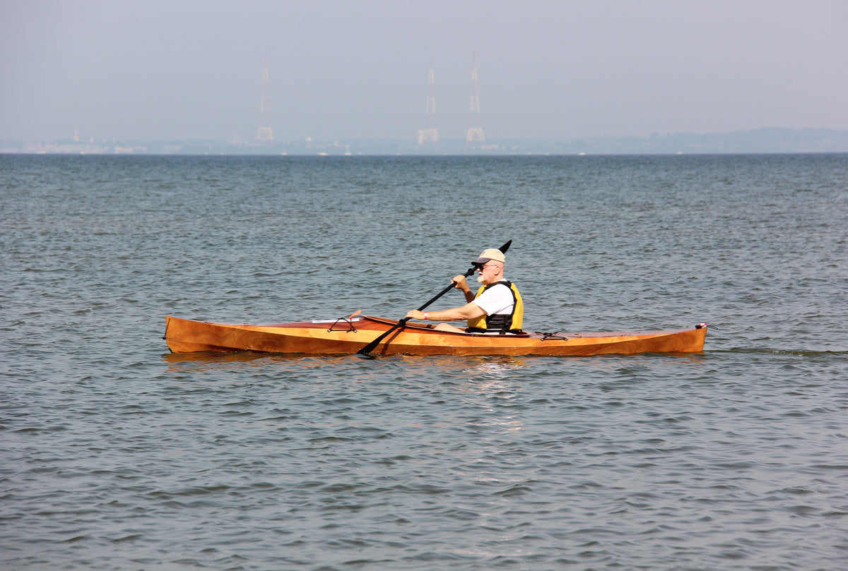 A man paddling a Wood Duck 14 kayak on the Chesapeake Bay near Annapolis