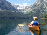 Cheryl J. paddling her Wood Duck 14 kayak on a lake in Grand Teton National Park Thumbnail