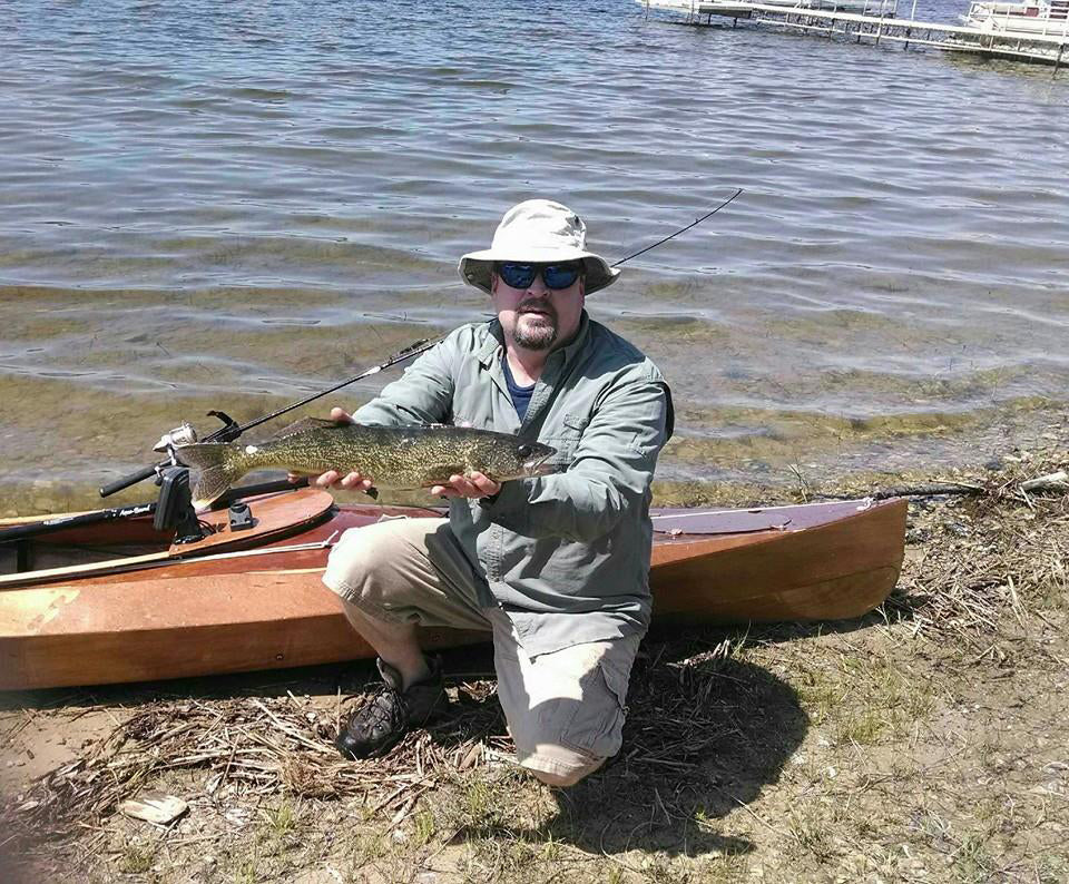 John O. showing the fish he caught from his Wood Duck 14 kayak