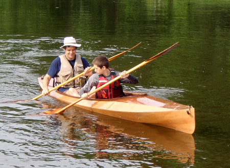 Nick S. and his son paddle in the marsh in a Wood Duck Double kayak