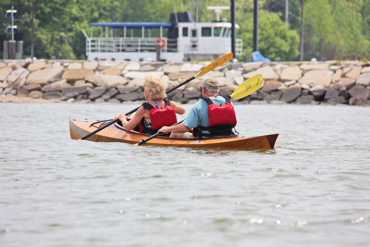 A couple paddling a Wood Duck Double kayak at OkoumeFest