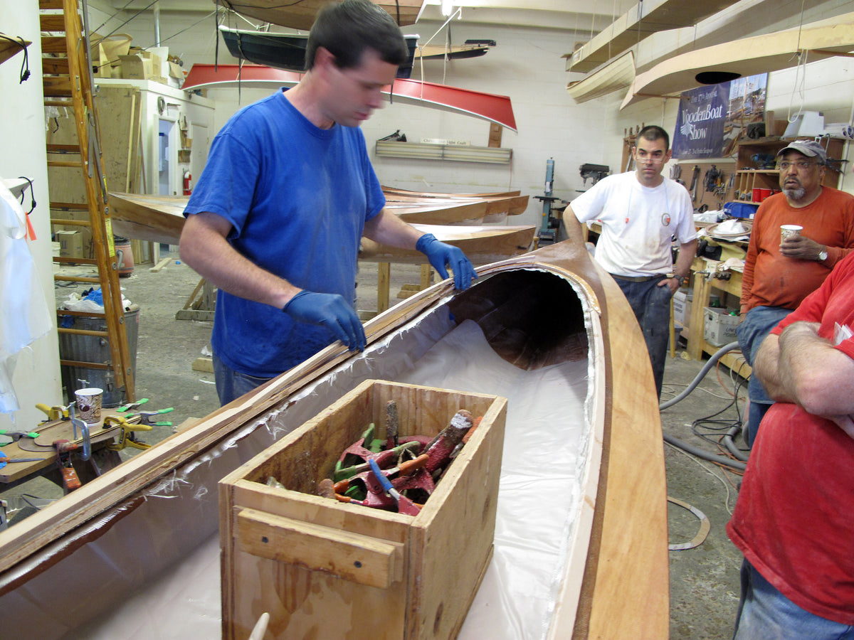 A Wood Duck Double kayak under construction in a class