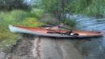 An Annapolis Wherry built by Bill P. pulled up on shore Thumbnail
