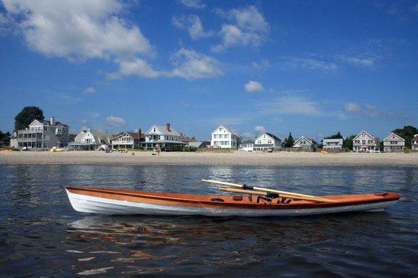 An Annapolis Wherry built by Ellen S. on the water at Fairfield Beach, Connecticut.
