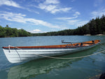 An Annapolis Wherry built by Chris W. floating on a scenic lake Thumbnail