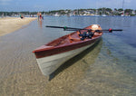An Annapolis Wherry built by Dave G. floating at a beach
 Thumbnail