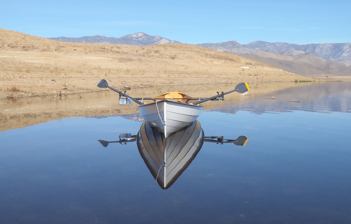 Eva H's Annapolis Wherry floating above its reflection on Isabella Lake, Cal.