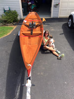 Nancy W. and her dog with her class-built Annapolis Wherry at home Thumbnail