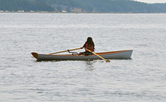 Woman rowing an Annapolis Wherry at the 2012 Port Townsend Wooden Boat Festival