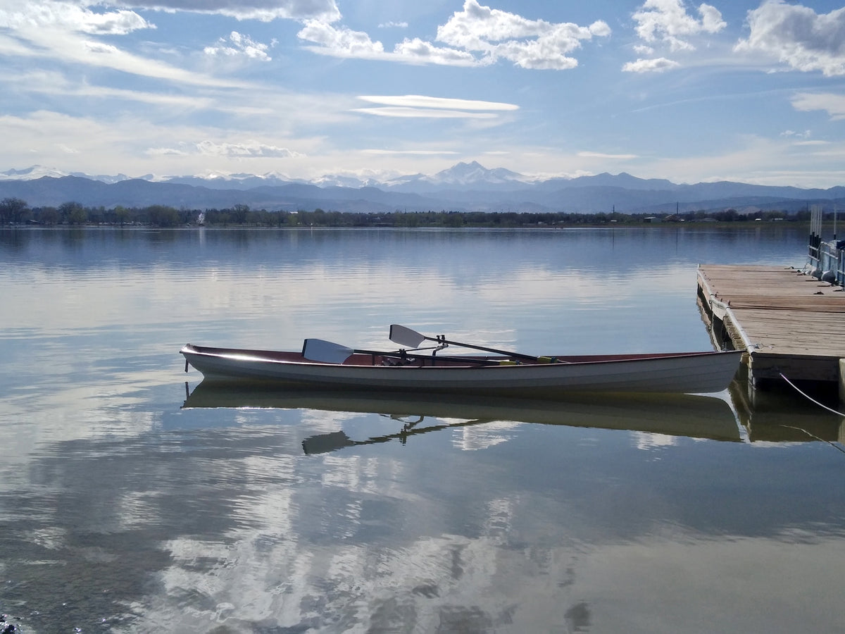 An Annapolis Wherry built by Rick J. floating at a dock on a lake in Colorado
