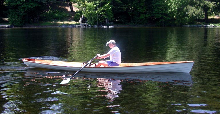 Rowing an Annapolis Wherry on a scenic lake