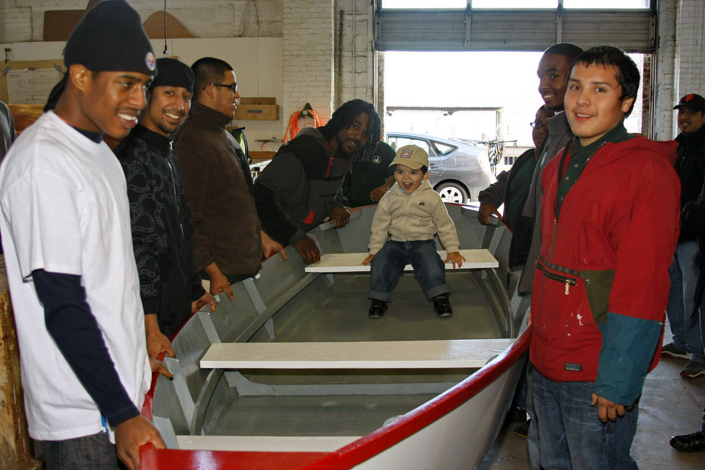 Happy students after they have finished building their Bevin's Skiff rowboat kit.