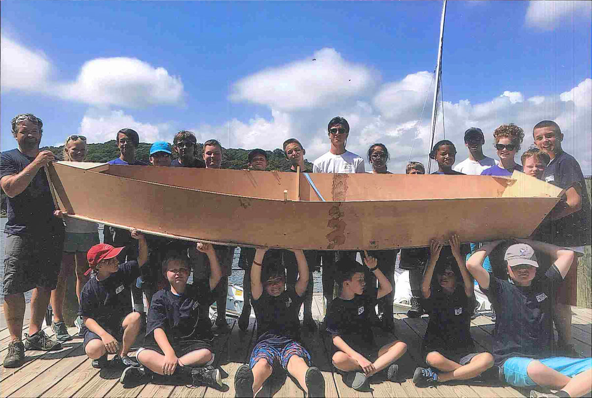 Young builders with a Bevin's Skiff at the Mystic Seaport sailing center