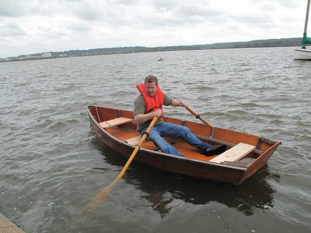 A man rowing a Bevin's Skiff