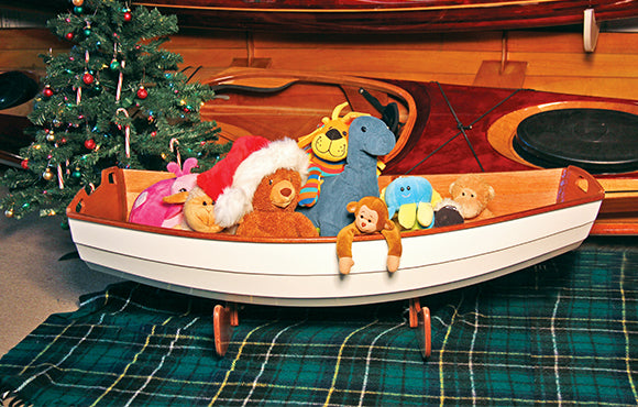 CLC Cradle Boat Kit filled with stuffed animals.