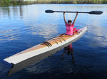 This woman loves her Chesapeake 16LT wooden kayak built by Mark N., and celebrates it on Black Creek at Fleming Island, FL Thumbnail