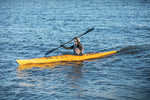 A woman enjoying a paddle in a Chesapeake 16LT wooden kayak Thumbnail
