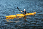 A woman paddling a Chesapeake 16LT wooden kayak Thumbnail