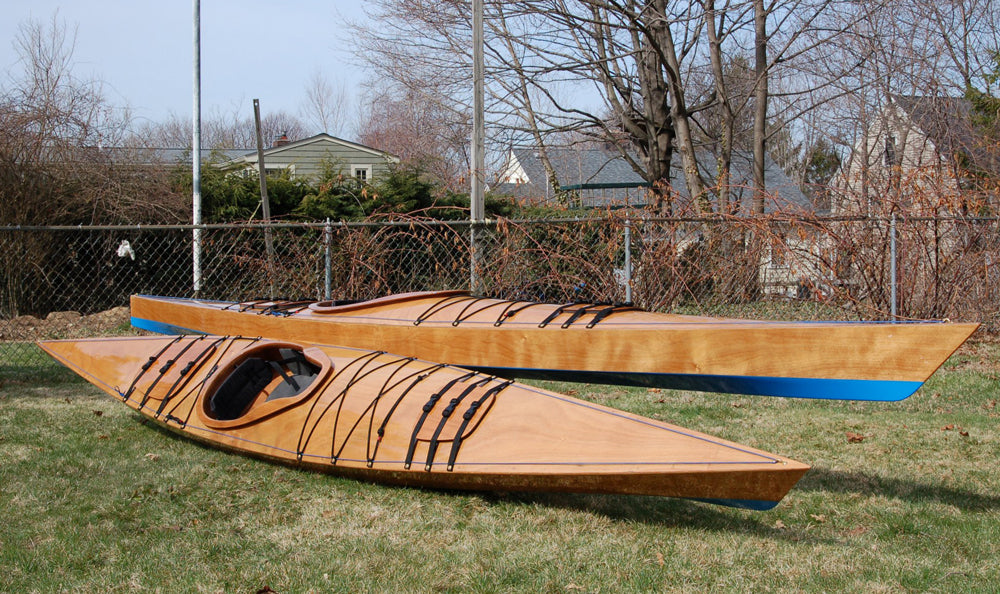 A pair of Chesapeake 16LT wooden kayaks built by Eric K. on the lawn