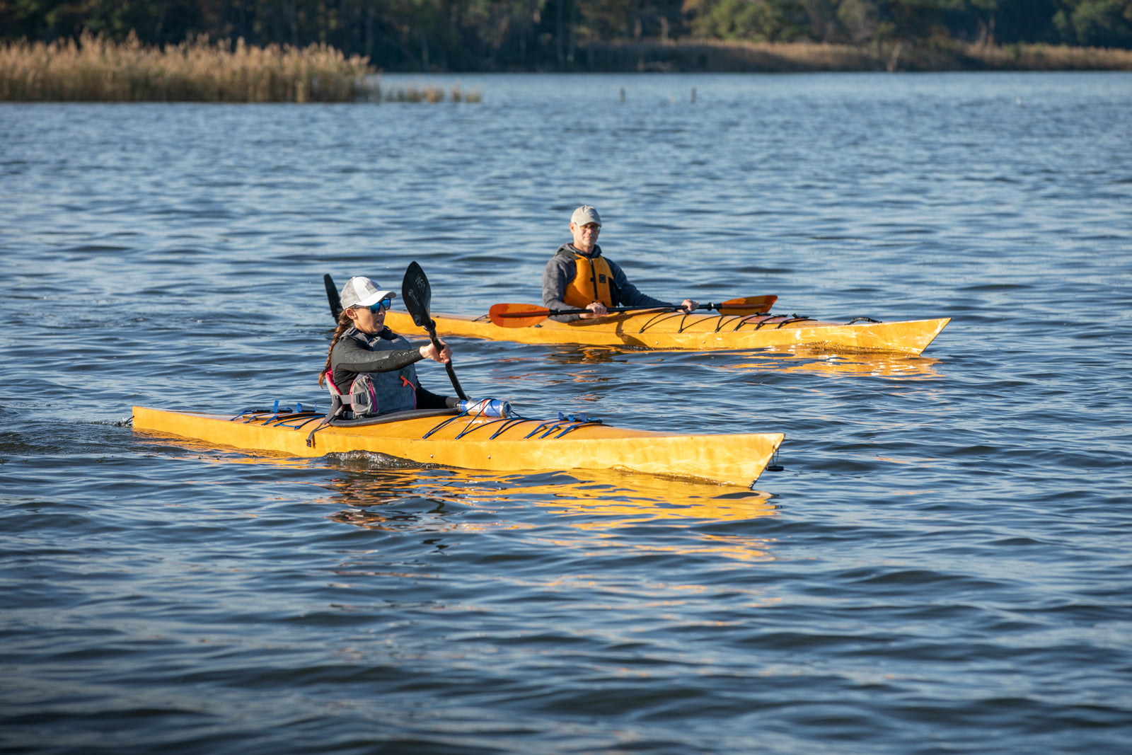 A woman paddling a Chesapeake 16LT alongside a man in a Chesapeake 17
