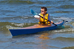 Young paddler on Deception Bay, Australia, in a Chesapeake 14 wooden kayak built by John F. Thumbnail
