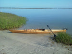 A beached Chesapeake 14 wooden kayak built by David M. Thumbnail