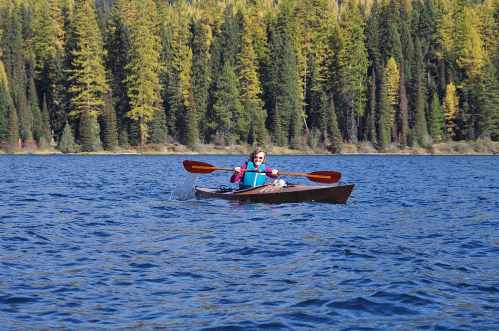 Patsy S. paddling a Chesapeake 14 wooden kayak on Lake Alva, Montana