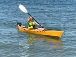 A young paddler in a Chesapeake 14 wooden kayak built by Tony O. Thumbnail