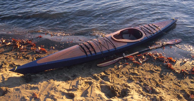 A wooden Chesapeake 14 kayak on the beach
