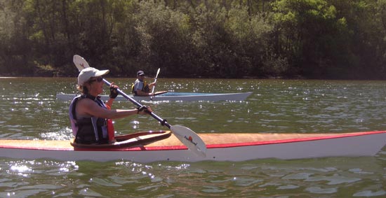Paddling a Chesapeake 14 wooden kayak on a river