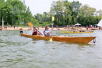 Two girls paddling a Chesapeake Sport Tandem wooden kayak at OkoumeFest Thumbnail