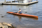 Person rowing the Surge Coastal Rower near a dock. Thumbnail