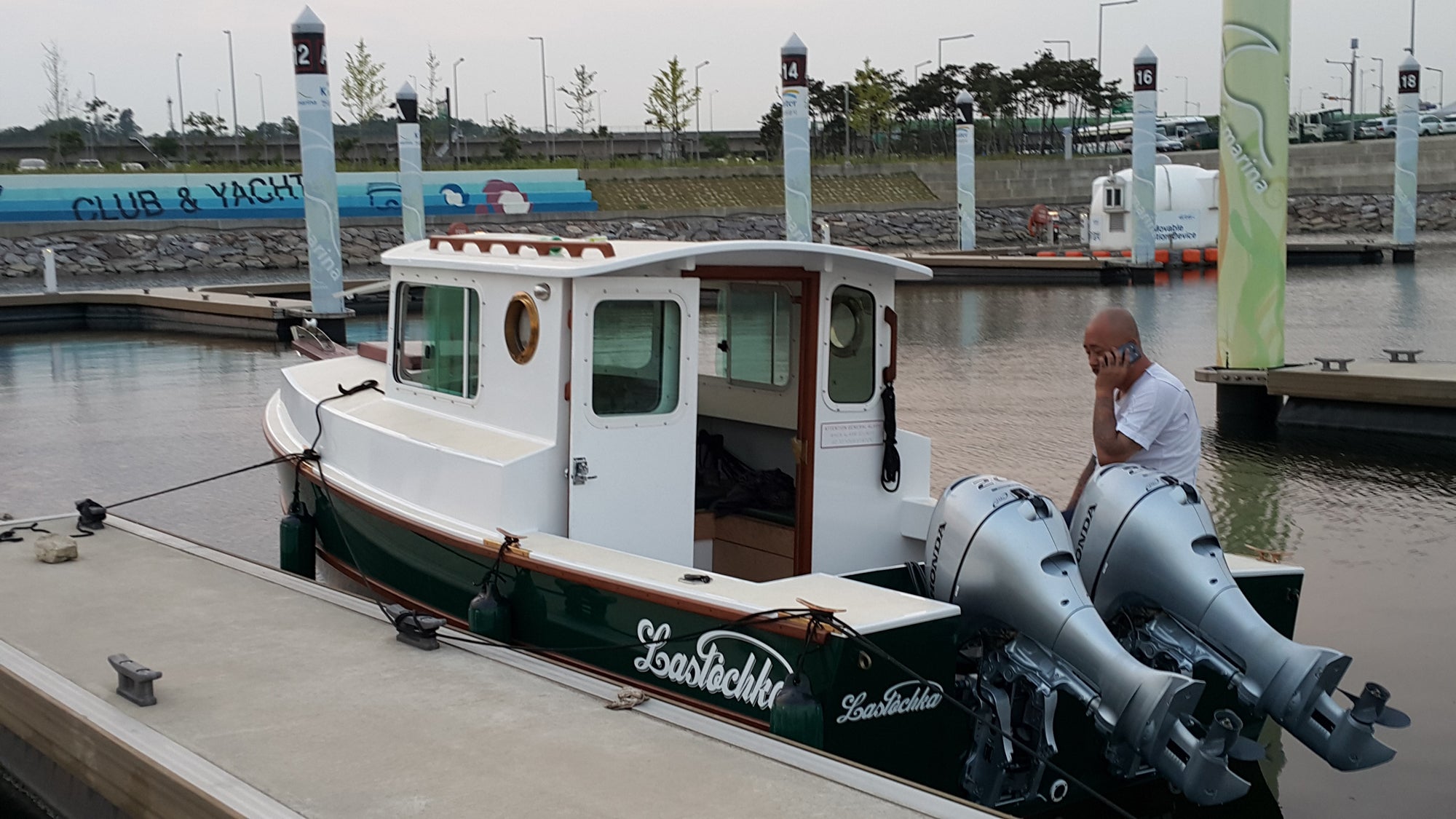 Dipper 19 with twin outboards, docked