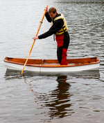 Having put the friend ashore, John H. has reassembled the hull and now tests capacity and stability when the Eastport Nesting Pram is fully submerged. Thumbnail