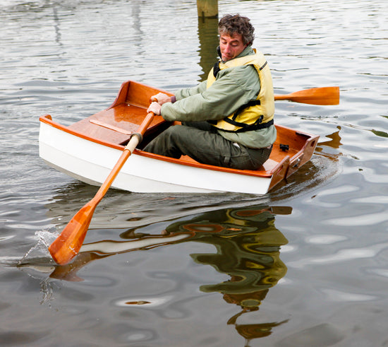 Eastport Nesting Pram's hull section passing a float test while attempting to row.