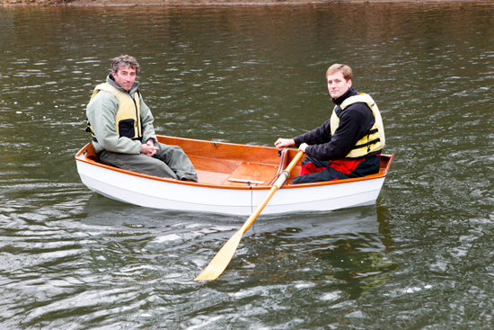 The joint on the Eastport Nesting Pram is clearly visible in this image of John Harris rowing with a friend.