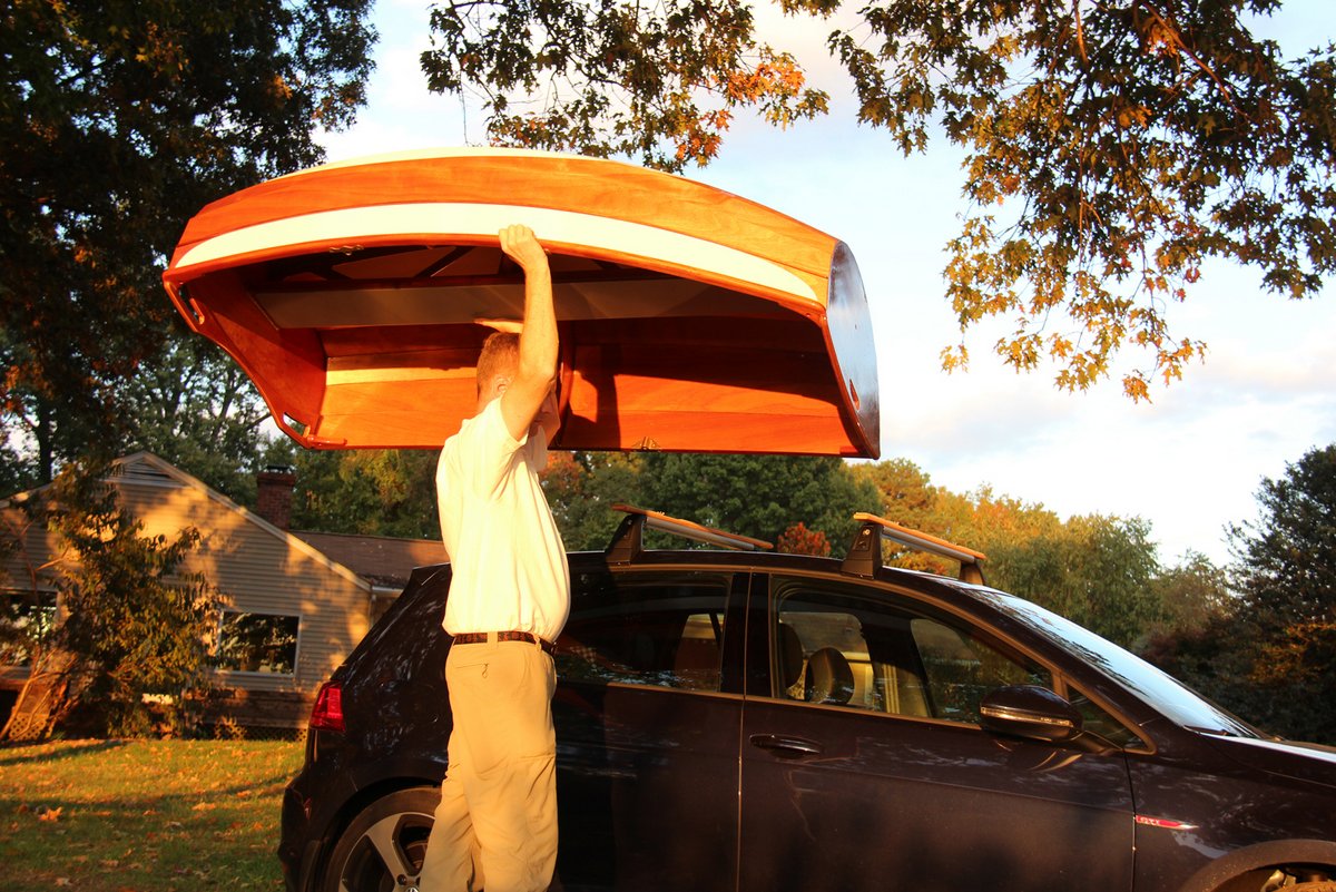 Lifting the Eastport Ultralight Dinghy  on top of the car.