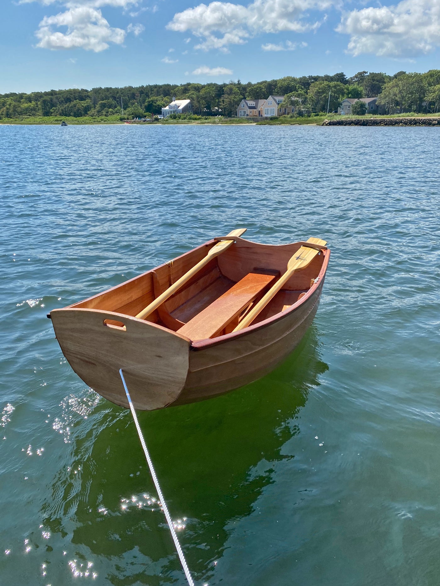 This Eastport Ultralight Dinghy awaits a passenger on Sengekontacket Pond in Edgartown, Massachusetts.