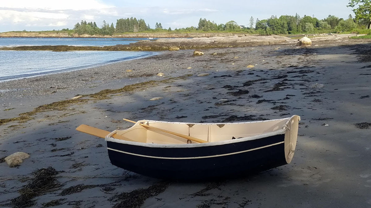 TATTOO is an Eastport Ultralight Dinghy  built by Frank K. at the high tide line on a Maine beach.