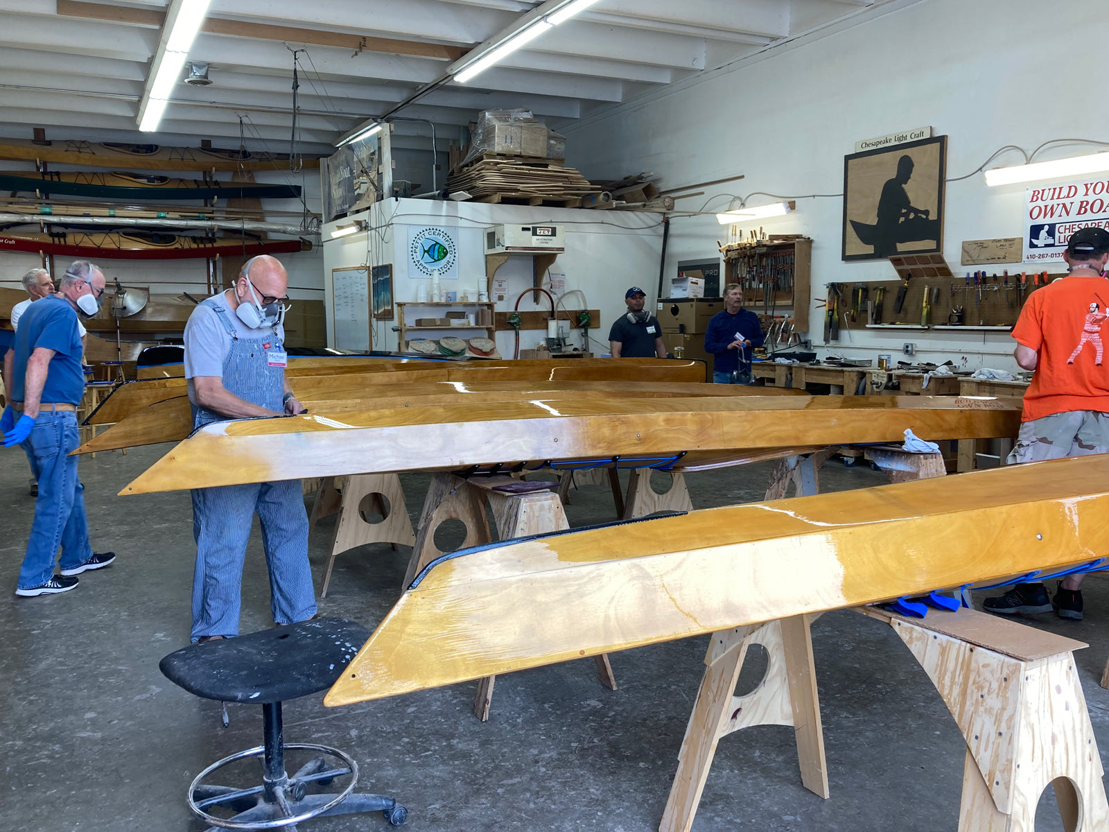 Wooden kayaks being varnished