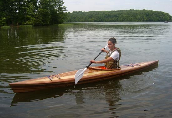 A woman paddling a Great Auk 14 sea kayak built by Dan G.