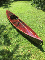 A Great Auk 14 sea kayak with dark deck and bright  highlight strips by Eric S. Thumbnail