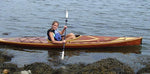 A girl paddling a Great Auk 14 along the coast of Maine Thumbnail