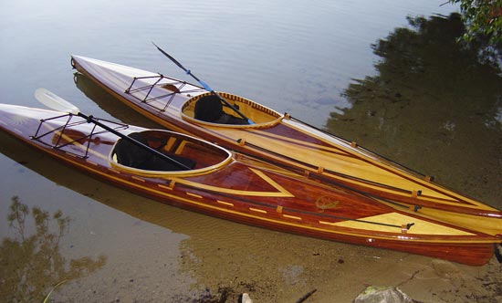A beautiful pair of Great Auk 14 sea kayaks pulled up at the edge of the water in Maine